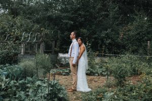 bride and groom in vegetable garden