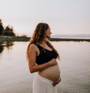pregnant woman standing in the water