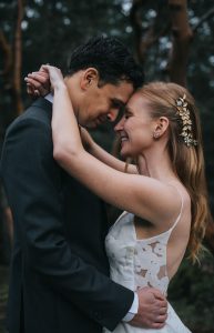 bride and groom embracing with their foreheads together