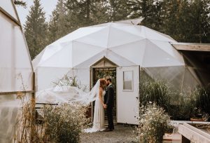 bride and groom standing in garden